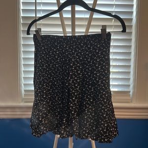 A. Byer Dainty white flower black print mini flare skirt.
